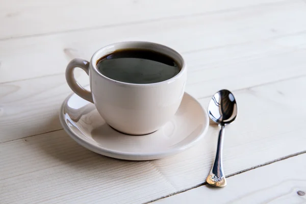 Tasse Kaffee auf grauem Holz — Stockfoto