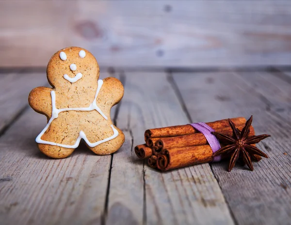 Christmas homemade gingerbread man on wooden background — Stock Photo, Image