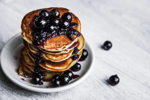 Picture of few pancakes with blackberries and sugar on wooden background — Stock Photo, Image