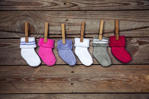 Knitted  socks on a wooden background — Stock Photo, Image