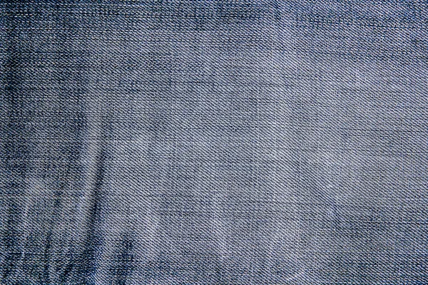 Texture of blue jeans textile close up — Stock Photo, Image
