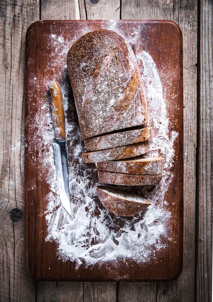 Food. sliced rye bread on a wooden background. Bread flour — Stock Photo, Image