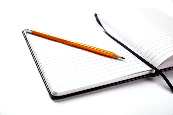 Pencil on notebook — Stock Photo, Image