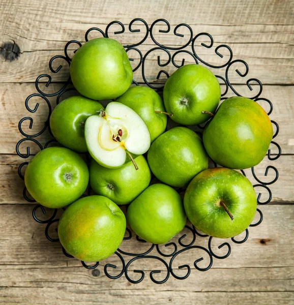 Fruit. apples in a bowl on wooden background — Stock Photo, Image