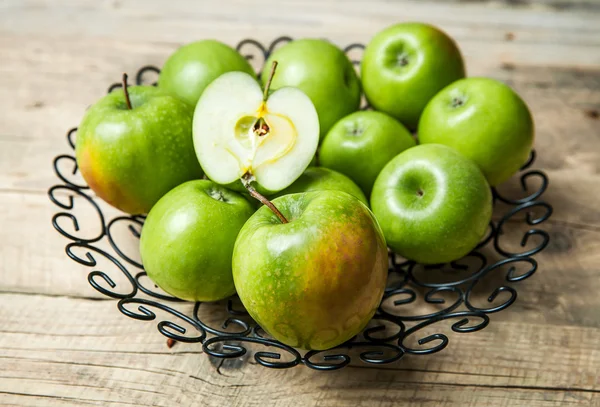 Fruit. apples in a bowl on wooden background — Stock Photo, Image