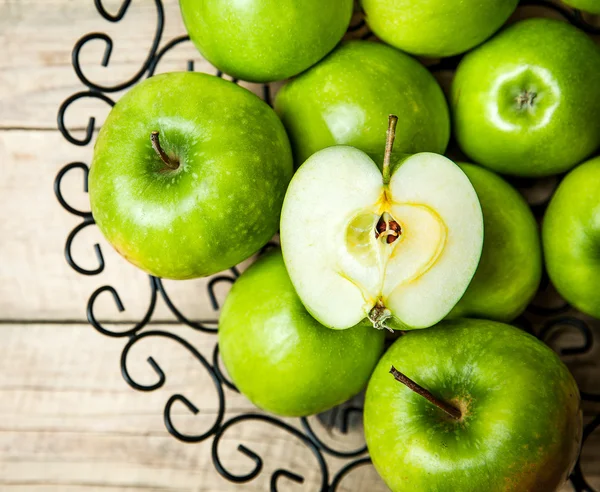 Fruit. apples in a bowl on wooden background — Stock Photo, Image