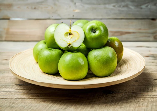 Fruit. apples in a bowl on wooden background — Stock Photo, Image