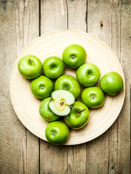 Fruit. apples in a bowl on wooden background — Stock Photo, Image