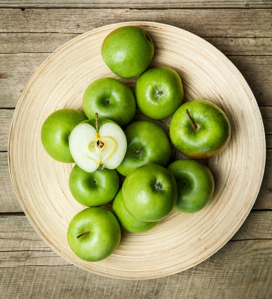 Fruit. apples in a bowl on wooden background — Stock Photo, Image