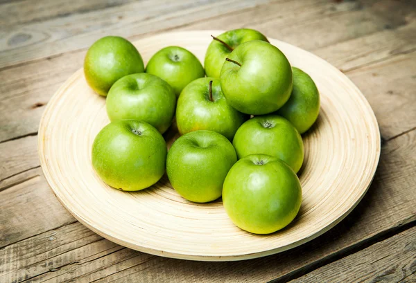 Fruit. apples in a bowl on wooden background — Stock Photo, Image