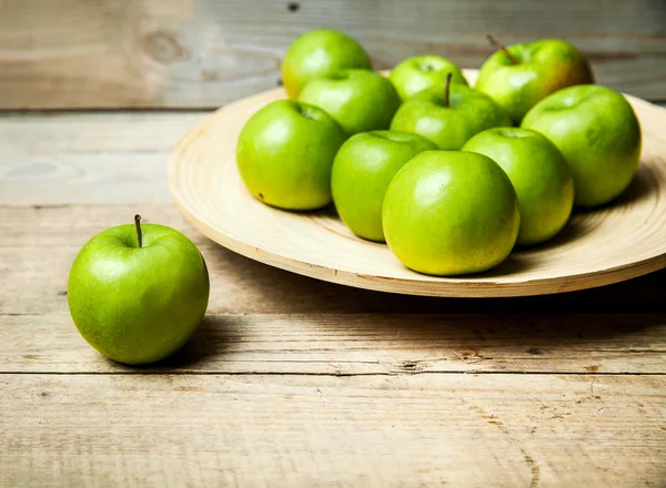 Fruit. apples in a bowl on wooden background — Stock Photo, Image