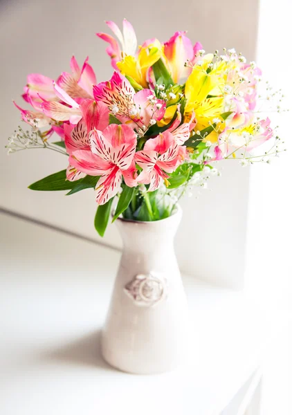 Alstroemeria flowers in vase on table — Stock Photo, Image