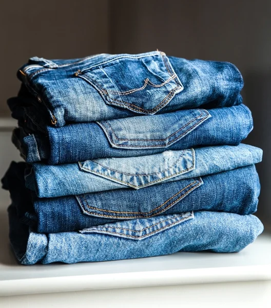 Lot of different blue jeans Blue Jeans. clothes — Stock Photo, Image