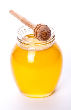 Cam Kavanoz bal beyaz bir arka plan üzerinde tam. Gıda, ilaç