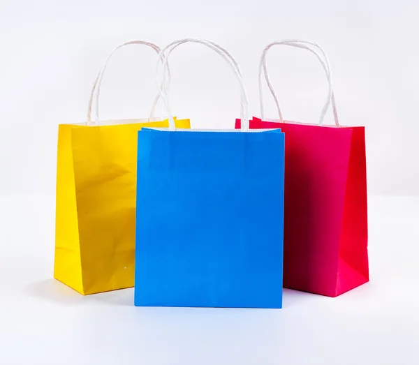 Multicolor Bolsas de compras sobre fondo blanco, venta, compra — Foto de Stock