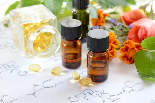 Alternative medicine with essential oils and supplement — Stock Photo, Image