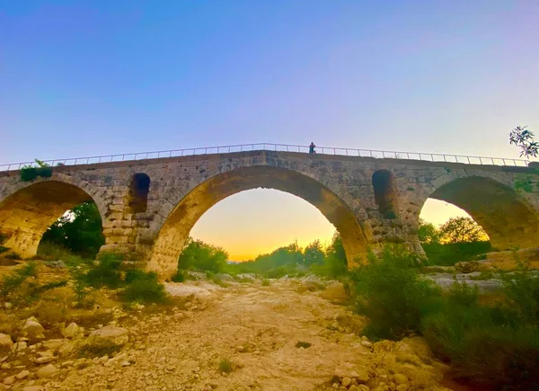 The old Roman arch stone bridge in Luberon