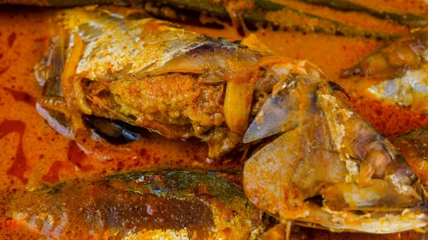 Delicious homemade Mackerel fish curry with lady finger cooked in coconut milk. Very popular dishes in Northern Malaysia.