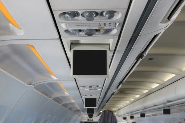 Monitor over head in airplane — Stock Photo, Image