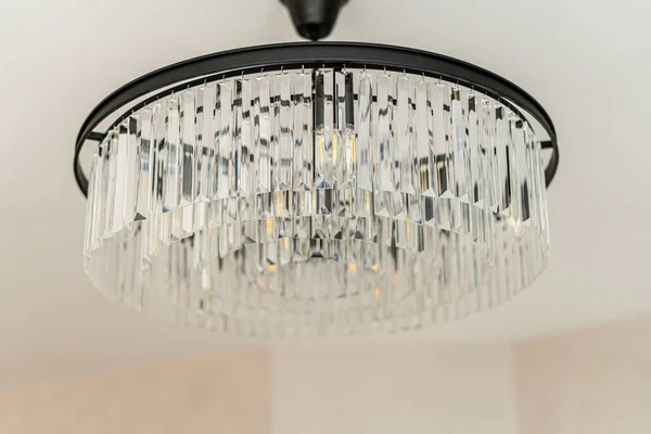 A glass chandelier hangs from the ceiling — Stock Photo, Image