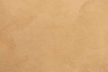 Taş duvar arkaplanı, pürüzsüz bej beton doku.