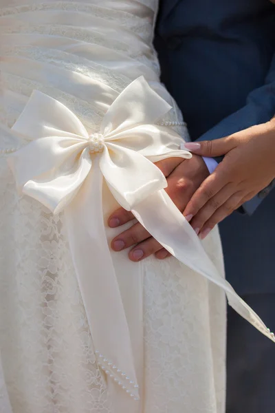 Bridesmaid bow on wedding dress — Stock Photo, Image