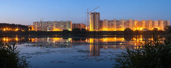 Construction of residential houses on the banks of the river in Royalty Free Stock Images