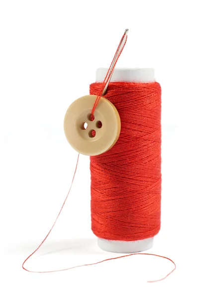 Spool of Red Thread with Needle and Button Isolated on White — Stock Photo, Image