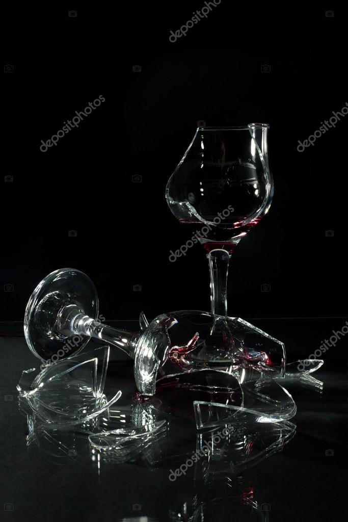 Broken Glass Cups with Reflection on a Glass Table Onr Black Background  Stock Photo by ©likstudio 66057515