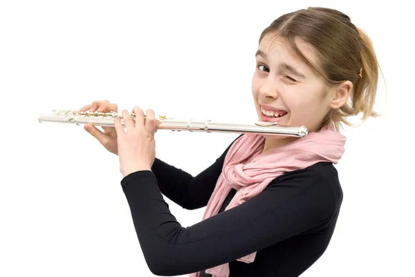 Studio záběr veselá dospívající dívka hospodářství flétnu a mrkl do kamery — Stock fotografie