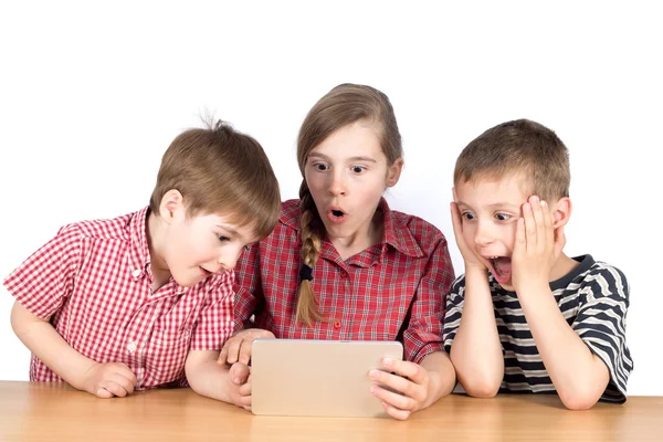 Group of Children Playing Exciting Game on Tablet Isolated on White — Stock fotografie