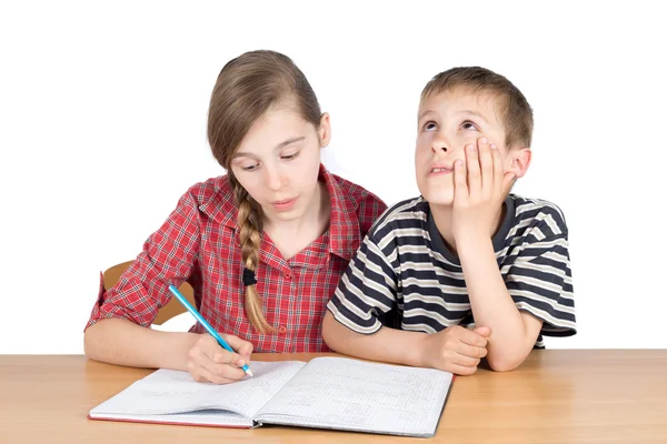 Sister Teaching Maths to Her Younger Disinterested Brother With Hand on Chin Isolated — Φωτογραφία Αρχείου