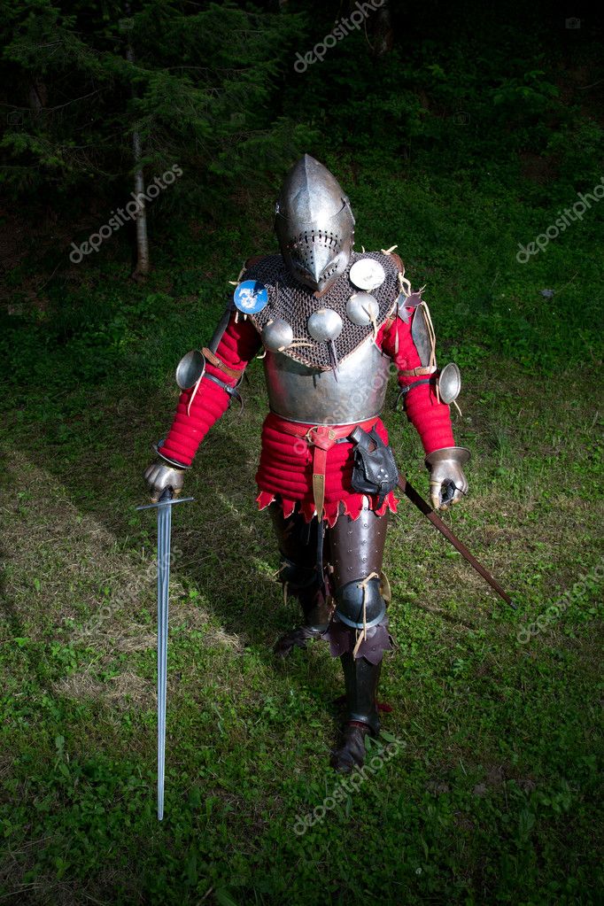 Medieval Knight in Armor With Chain Mail, Metal Helmet and Sword