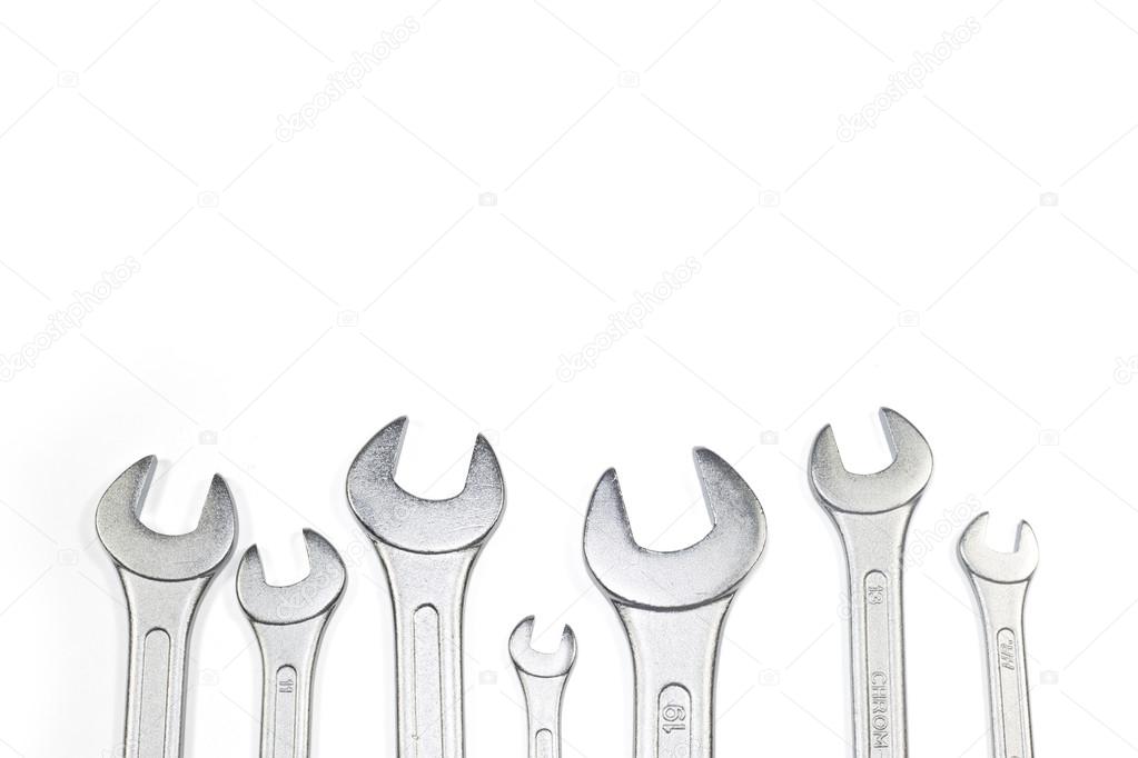 Heap Of Stainless Steel Spanners Of Different Sizes Isolated On White, View From The Top