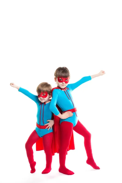 Portrait of two boys in the full-length plays a superhero. — Stock Photo, Image