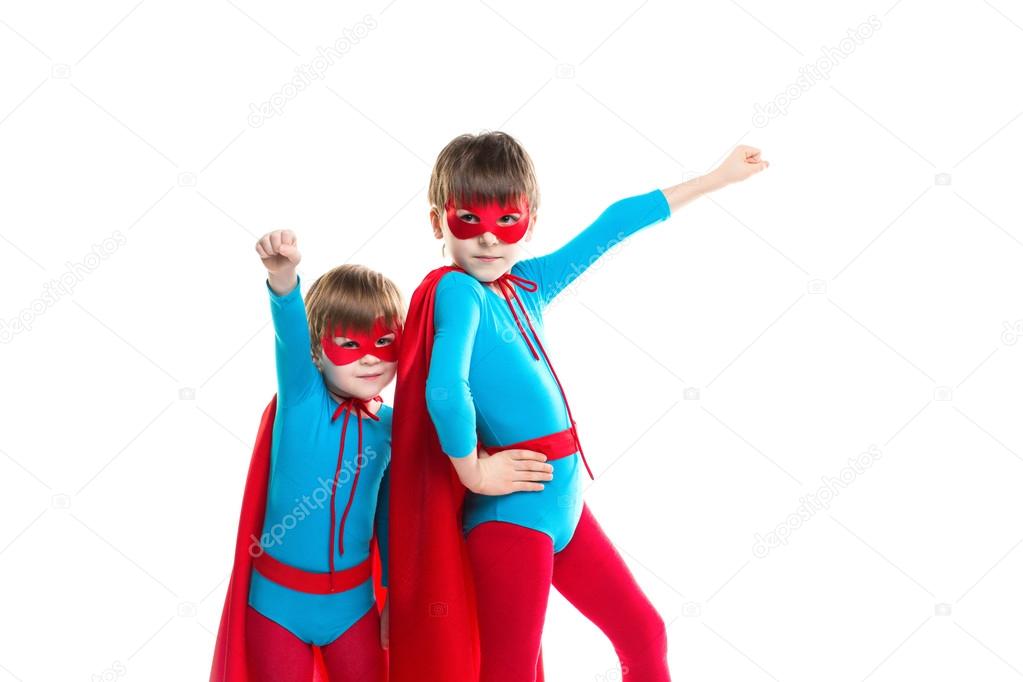 Two boys playing in a superhero isolated.