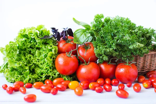 Fresh tomatoes and herbs. — Stock Photo, Image