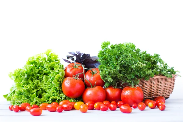 Fresh tomatoes and various herbs. — Stock Photo, Image