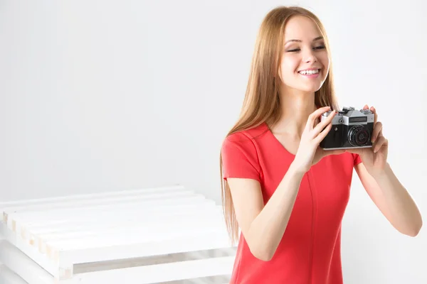 Happy smiling stylish teenager with vintage camera — Stock Photo, Image