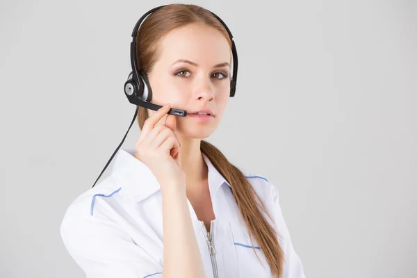 Portrait of happy smiling cheerful support phone operator in headset with a business card — Stock Photo, Image