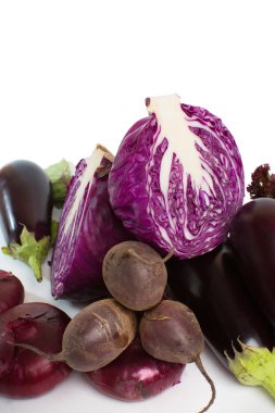Red cabbage is a cross-sectional, eggplant, red onion, beetroot and salad closeup  clipart