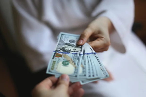 Arms transfer money — Stock Photo, Image