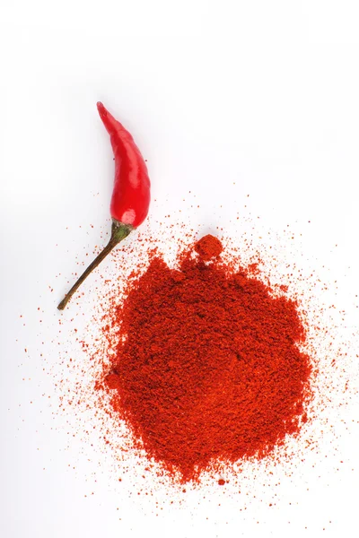 Hot peppers and chili powder — Stock Photo, Image