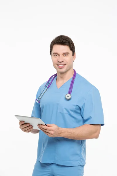 Portrait of a charming male nurse working on tablet pc — Stock Photo, Image