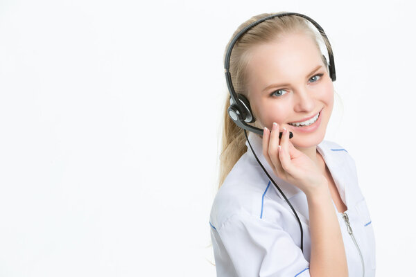 Young happy doctor in headset, at office, call center smiling operator