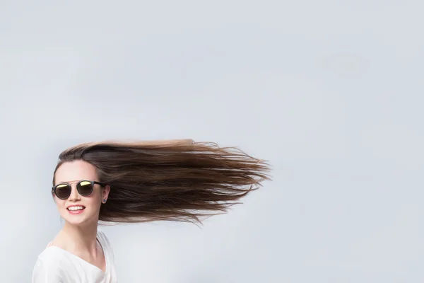 Cheerful woman with hair in the wind — Stock Photo, Image