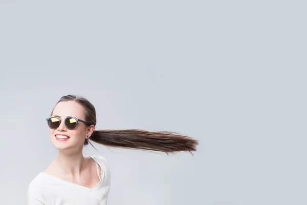 Cheerful woman with hair in the wind — Stock Photo, Image