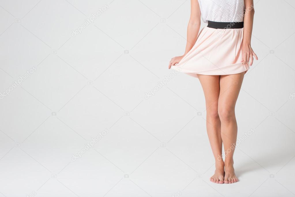Female legs in a skirt 