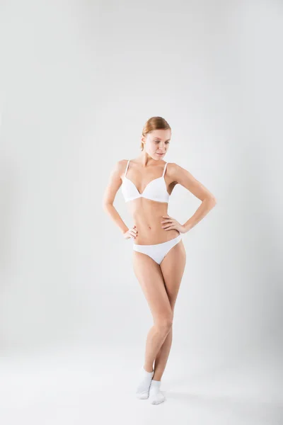 Woman in a full-length in underwear — Stock Photo, Image