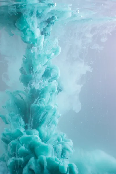 Turquoise ink in water — Stock Photo, Image